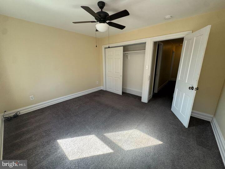 405 Walnut Street Royersford, PA 19468 - Photo 17 of 26 an empty room with a ceiling fan and hardwood floor