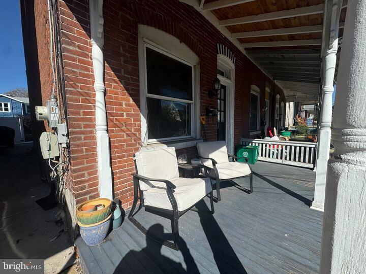 405 Walnut Street Royersford, PA 19468 - Photo 4 of 26 a view of a deck with chair and table