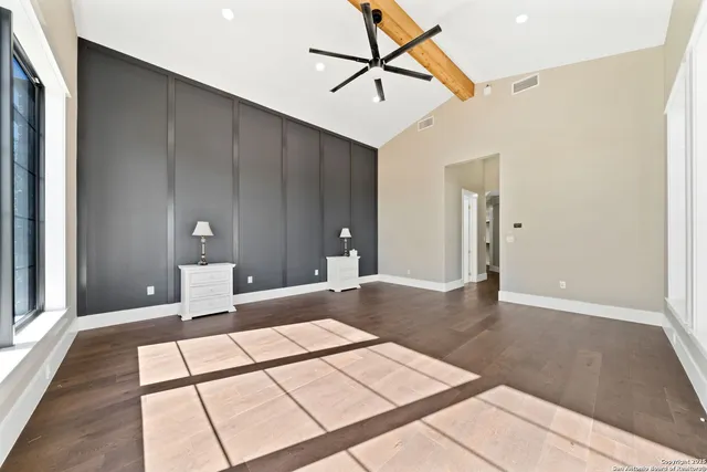 a living room with a couch and a rug