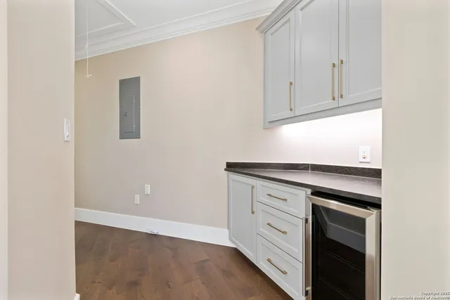 a view of cabinets and wooden floor