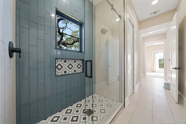 a bathroom with a bathtub and shower