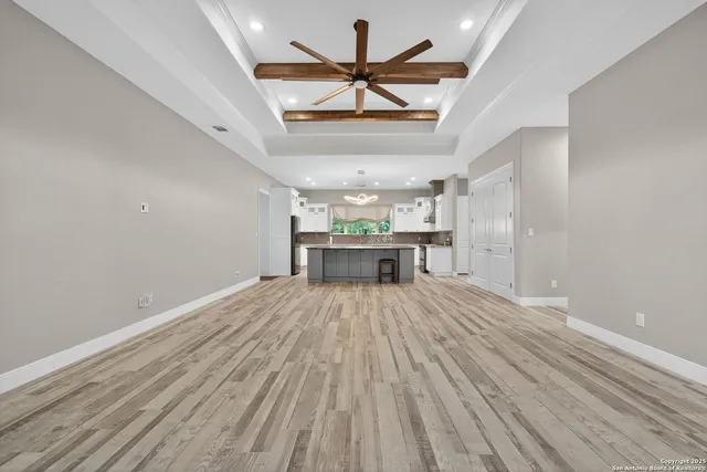 a view of a room with a wooden floor