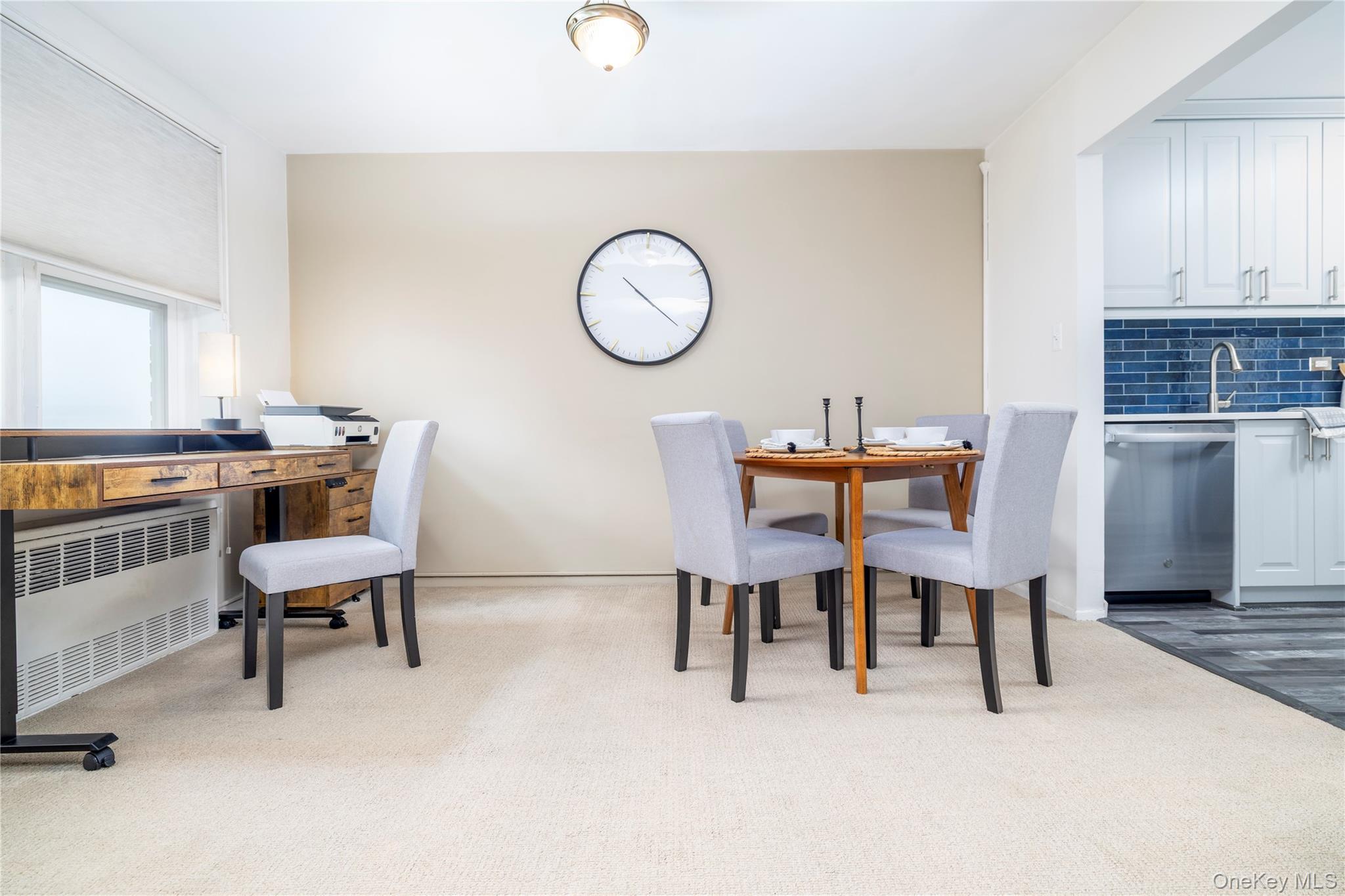 522 Shore Road, Unit 6C Long Beach, NY 11561 - Photo 9 of 25 Carpeted dining room featuring radiator heating unit and baseboards