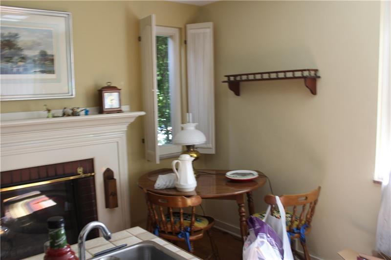 319 Churchill Road Pittsburgh, PA 15235 - Photo 8 of 25 Kitchen has decorative fireplace