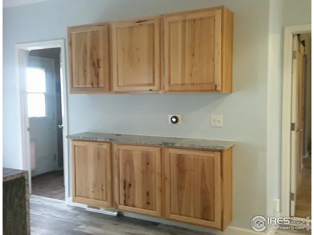 a view of cabinets and wooden floor