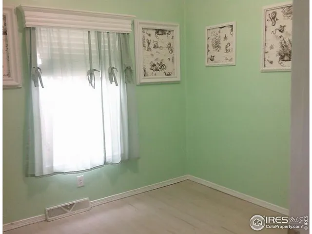 a view of a small space with window and bathroom