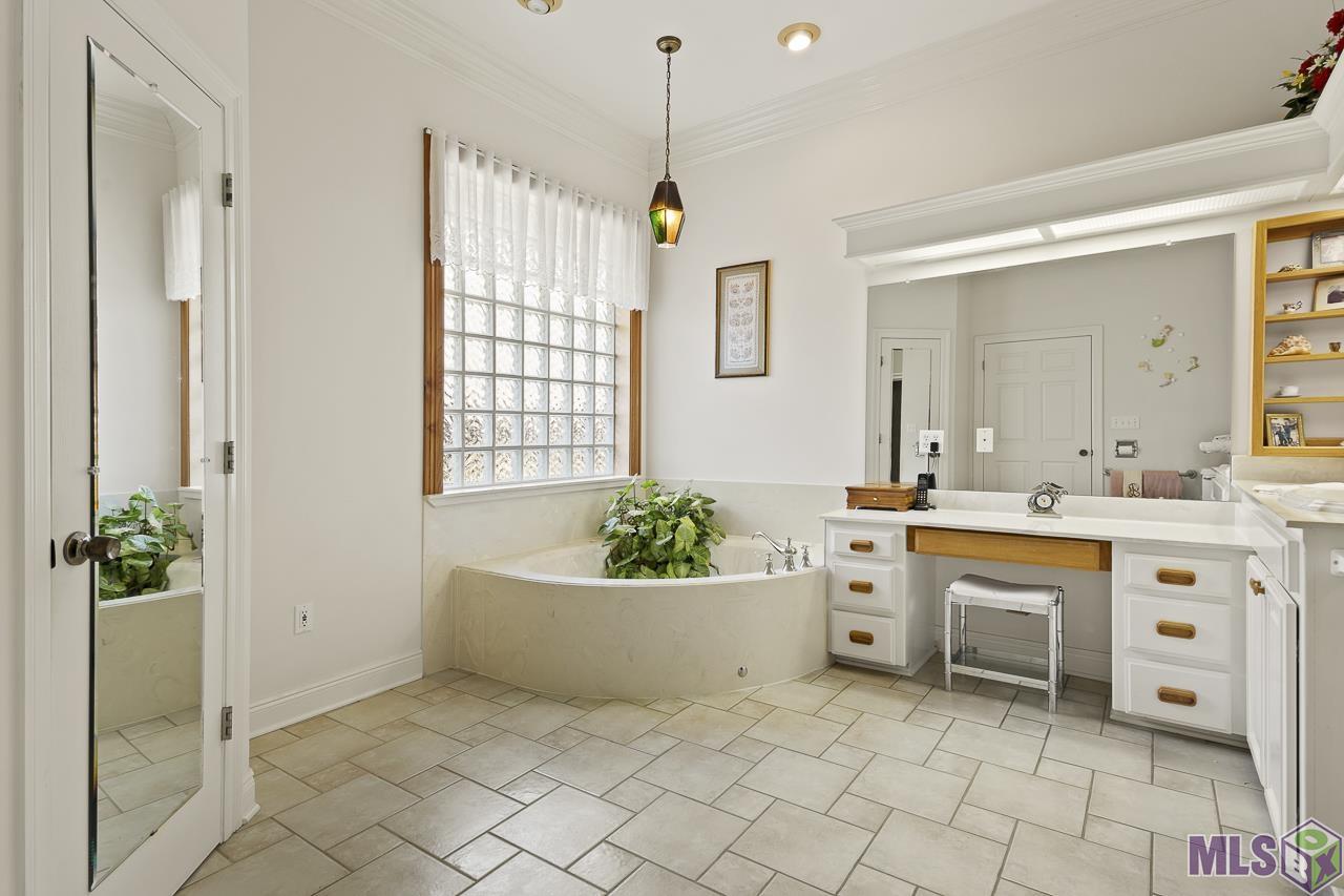 15751 Port Hudson-Pride Road Pride, LA 70770 - Photo 11 of 43 Primary Hers Bathroom