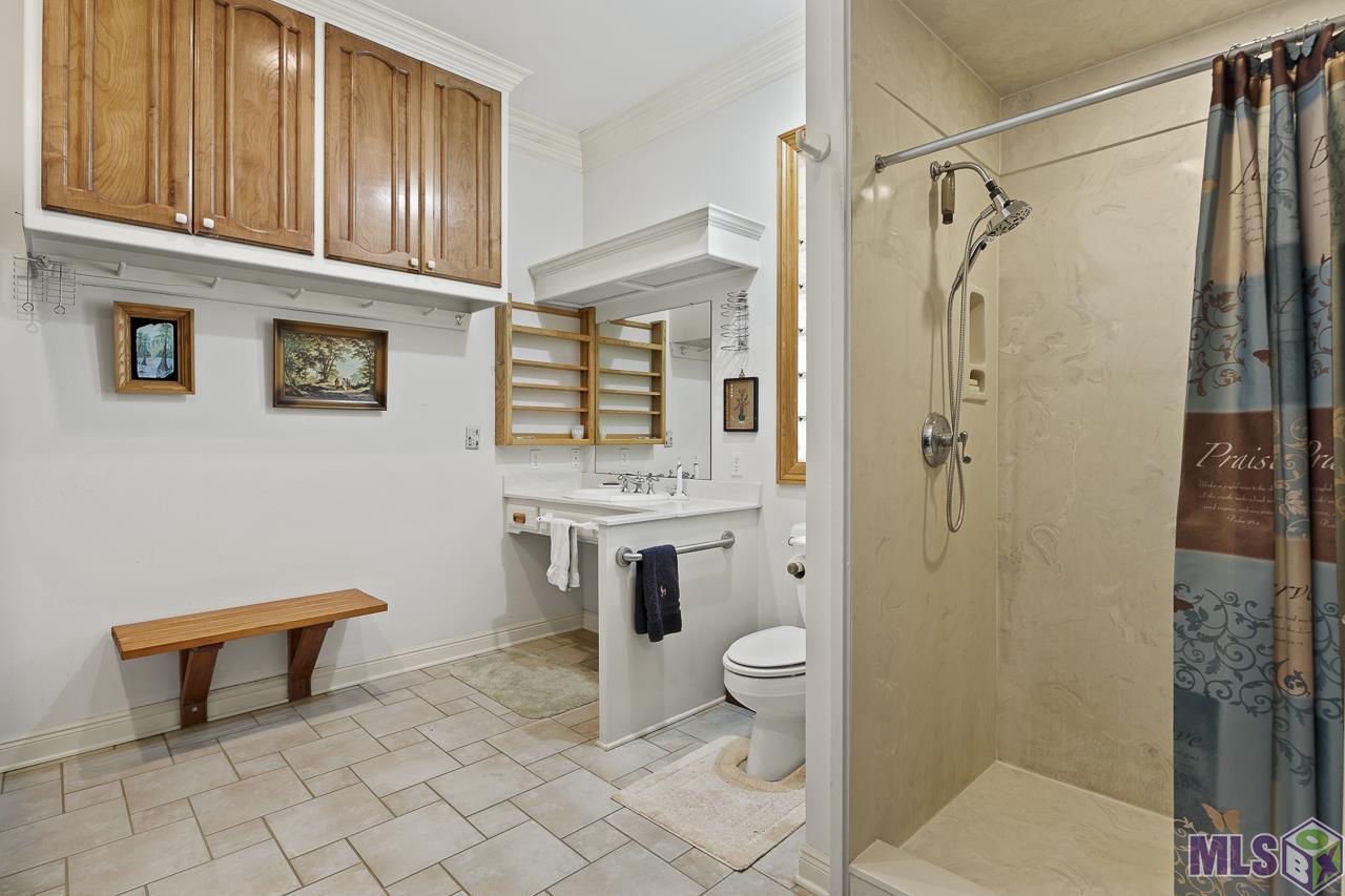 15751 Port Hudson-Pride Road Pride, LA 70770 - Photo 14 of 43 Primary His Bathroom