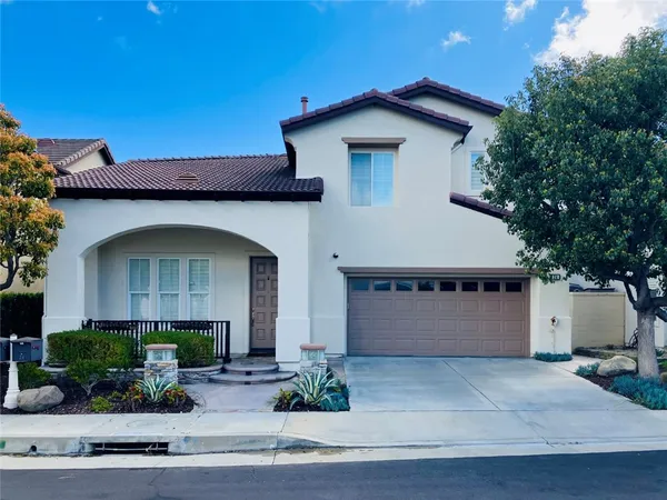 a front view of a house with garage