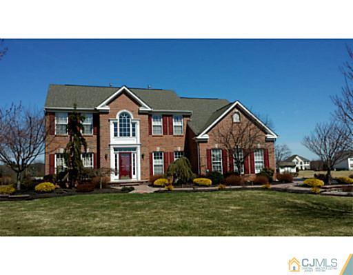 1 Sunflower Road Somerset, NJ 08873 - Photo 1 of 25 a front view of a house with a yard