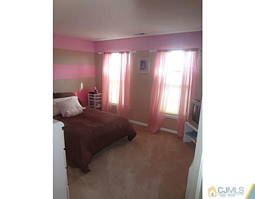 1 Sunflower Road Somerset, NJ 08873 - Photo 23 of 25 a bedroom with a bed and a window