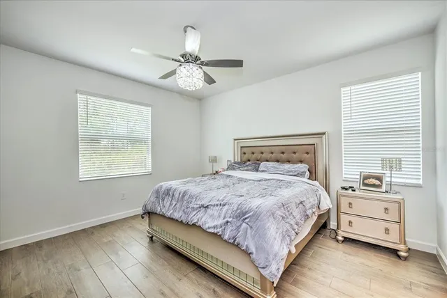 a bedroom with a large bed and a window