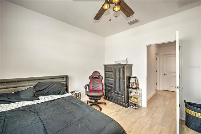 a bedroom with furniture and natural light
