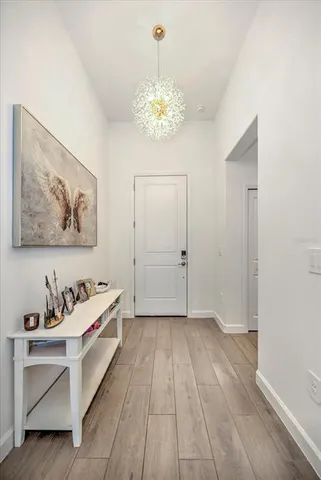 a very nice looking room with a large mirror and a chandelier fan