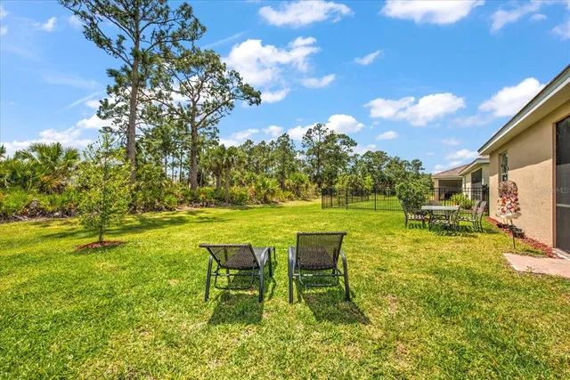a view of a swimming pool with a table and chairs