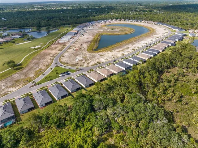 a view of a swimming pool with a yard