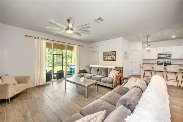 a living room with furniture and a large window