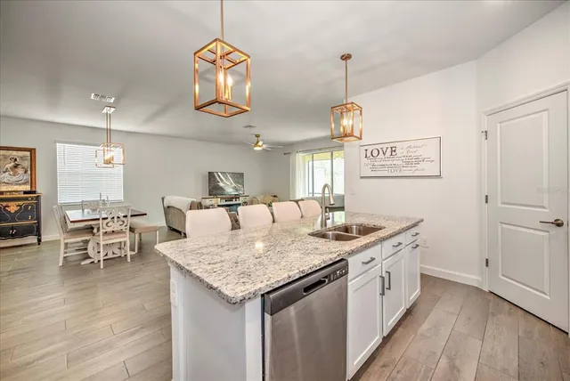 a kitchen with a table and chairs