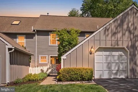a side view of a house with a yard