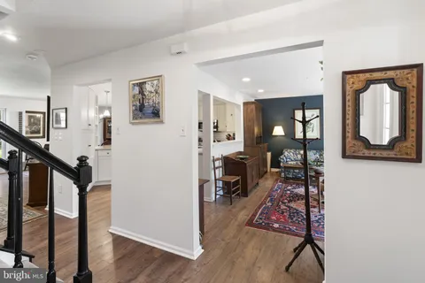 a living room with furniture rug and wooden floor