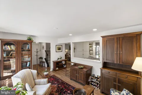 a living room with furniture window and wooden floor