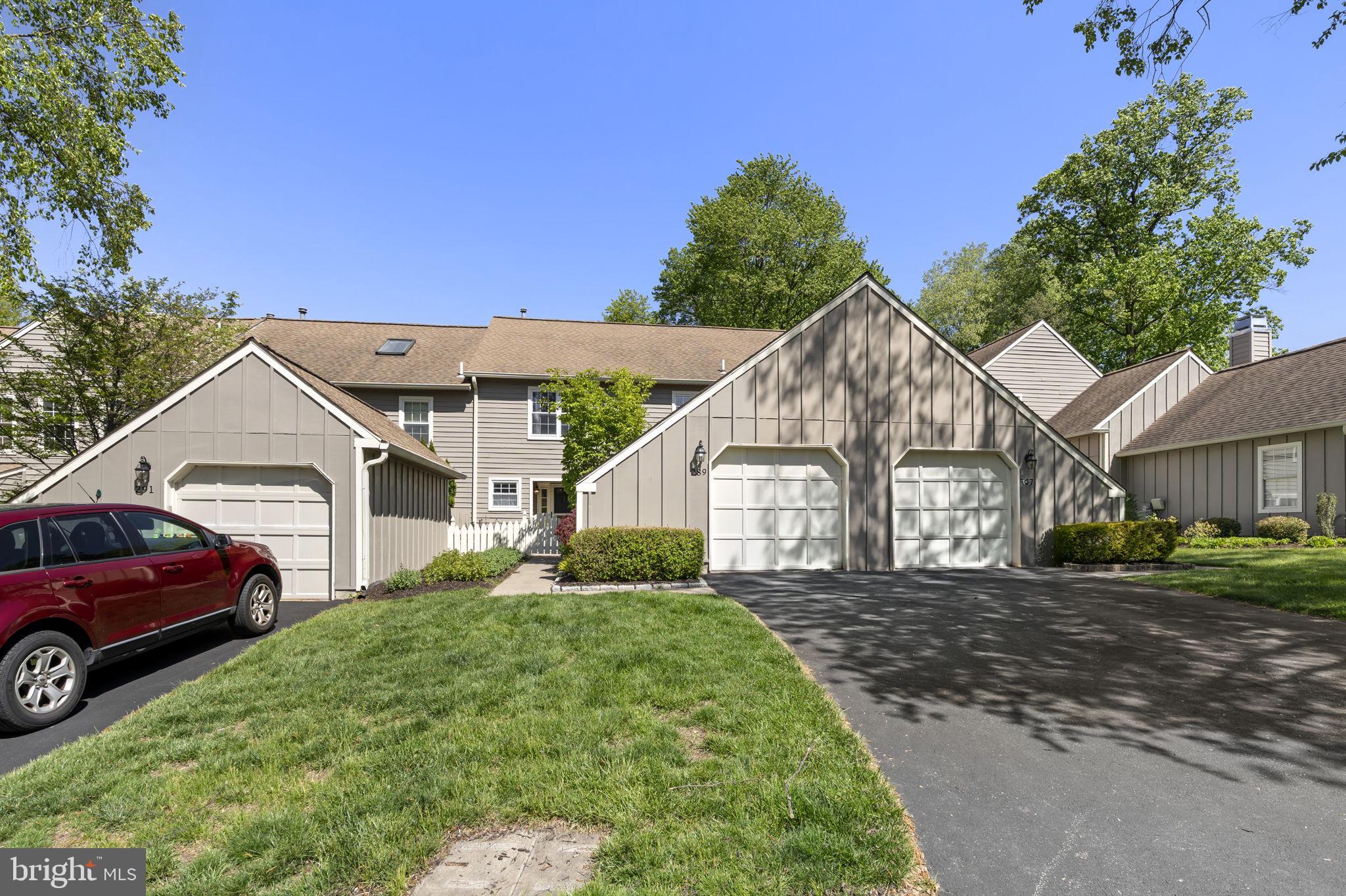 289 Tulip Tree Court Blue Bell, PA 19422 - Photo 2 of 51 a front view of a house with a garden