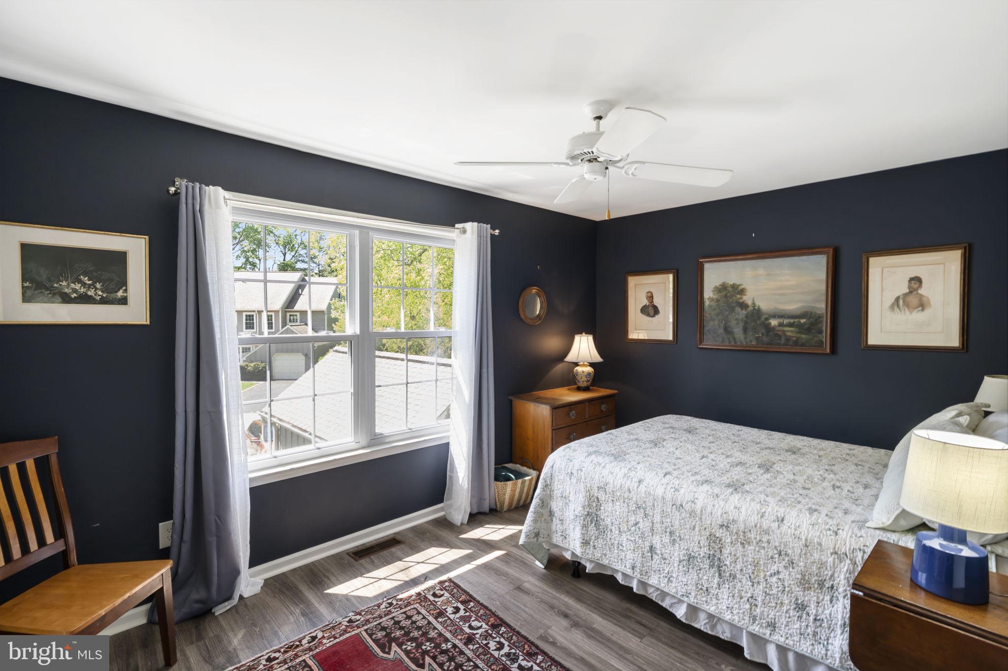 289 Tulip Tree Court Blue Bell, PA 19422 - Photo 30 of 51 a bedroom with a bed and wooden floor