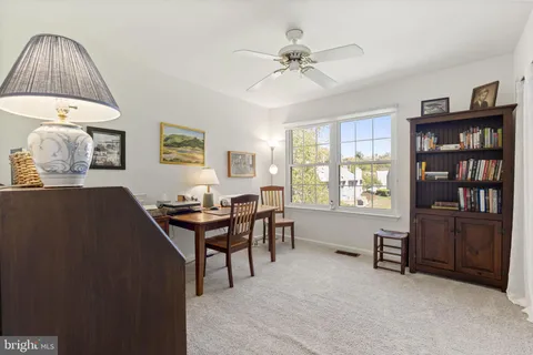 a view of a livingroom with furniture and window