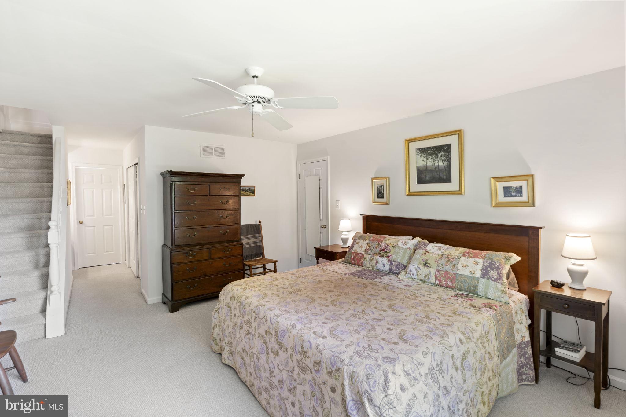 289 Tulip Tree Court Blue Bell, PA 19422 - Photo 37 of 51 a bedroom with a bed and a chandelier
