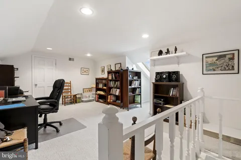 a view of a workspace with furniture