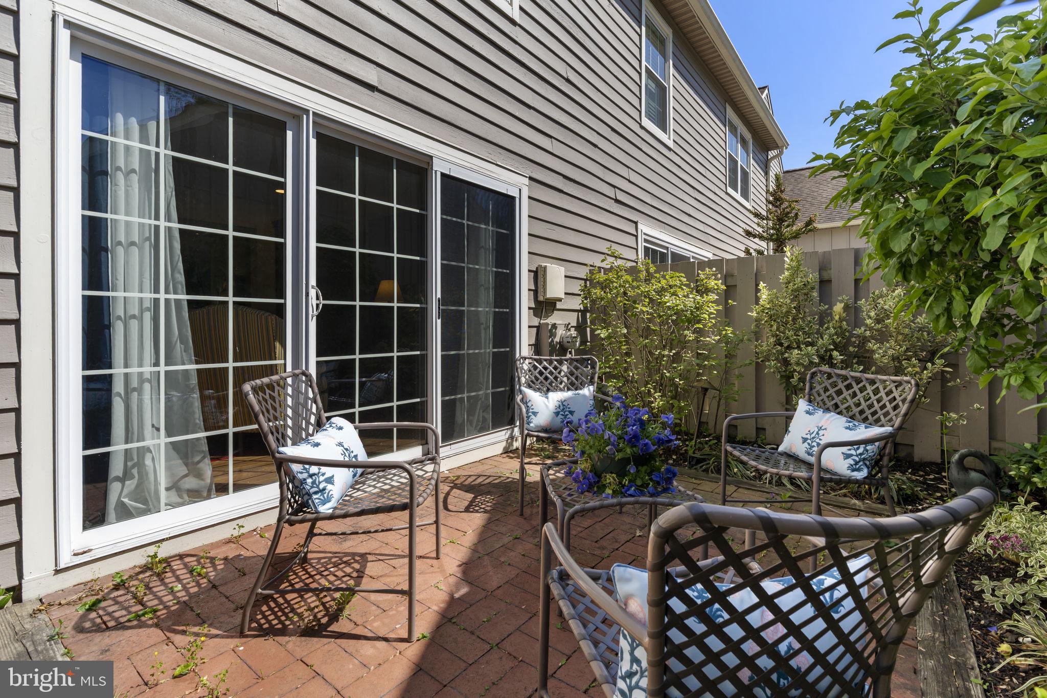 289 Tulip Tree Court Blue Bell, PA 19422 - Photo 9 of 51 a building outdoor space with patio furniture and potted plants