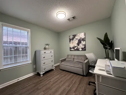 a living room with furniture and a window