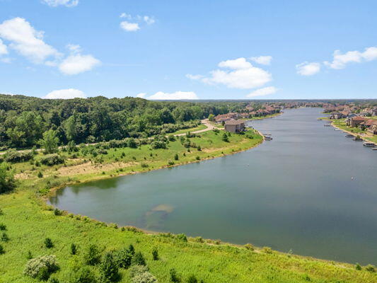 10830 Bridgewater Court Crown Point, IN 46307 - Photo 21 of 25 a view of an ocean and a yard