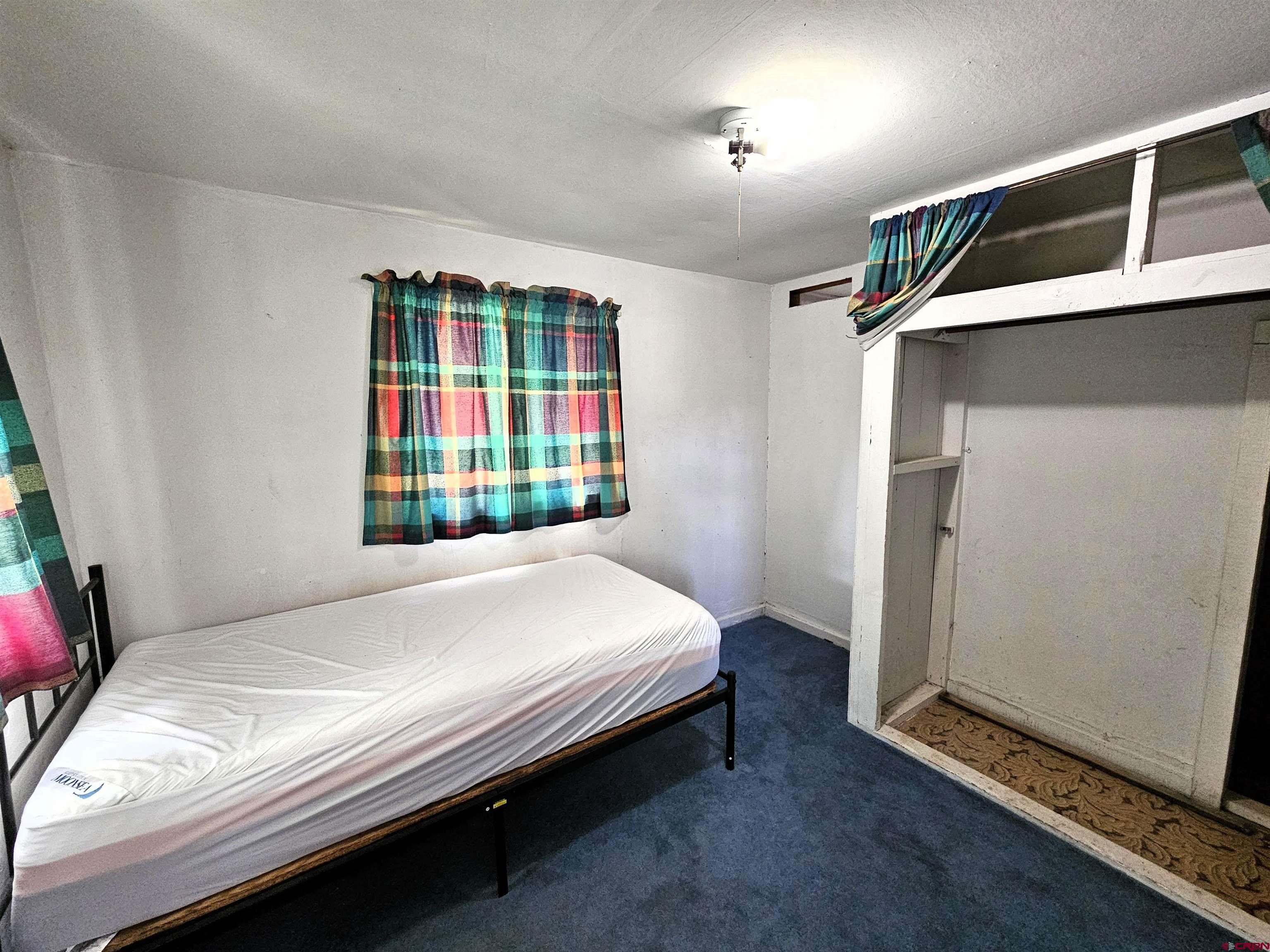 360 West 30th Street Durango, CO 81301 - Photo 16 of 30 a bedroom with a bed and a window