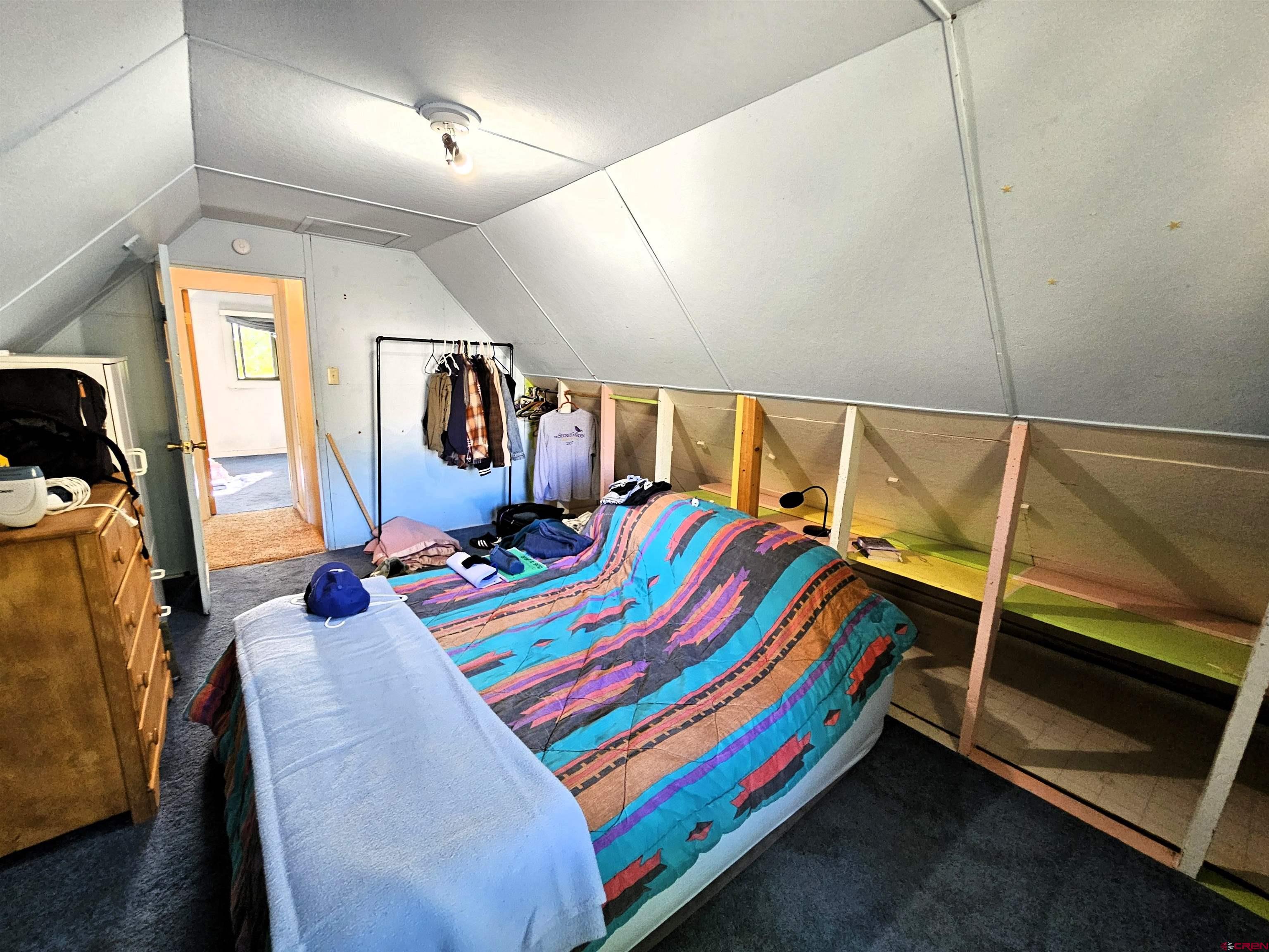 360 West 30th Street Durango, CO 81301 - Photo 20 of 30 a room that has a bed and a dresser
