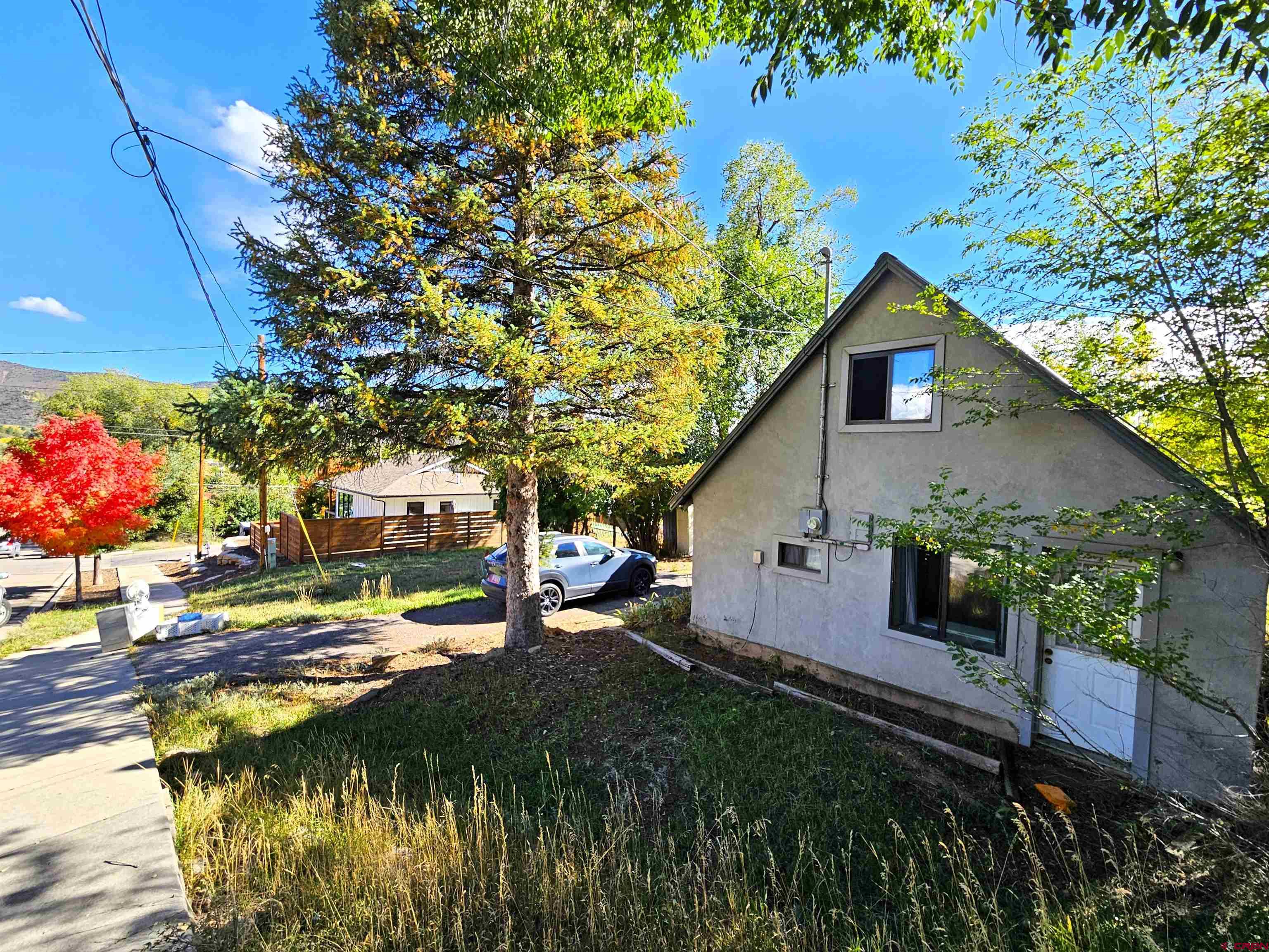 360 West 30th Street Durango, CO 81301 - Photo 2 of 30 a backyard of a house with lots of green space