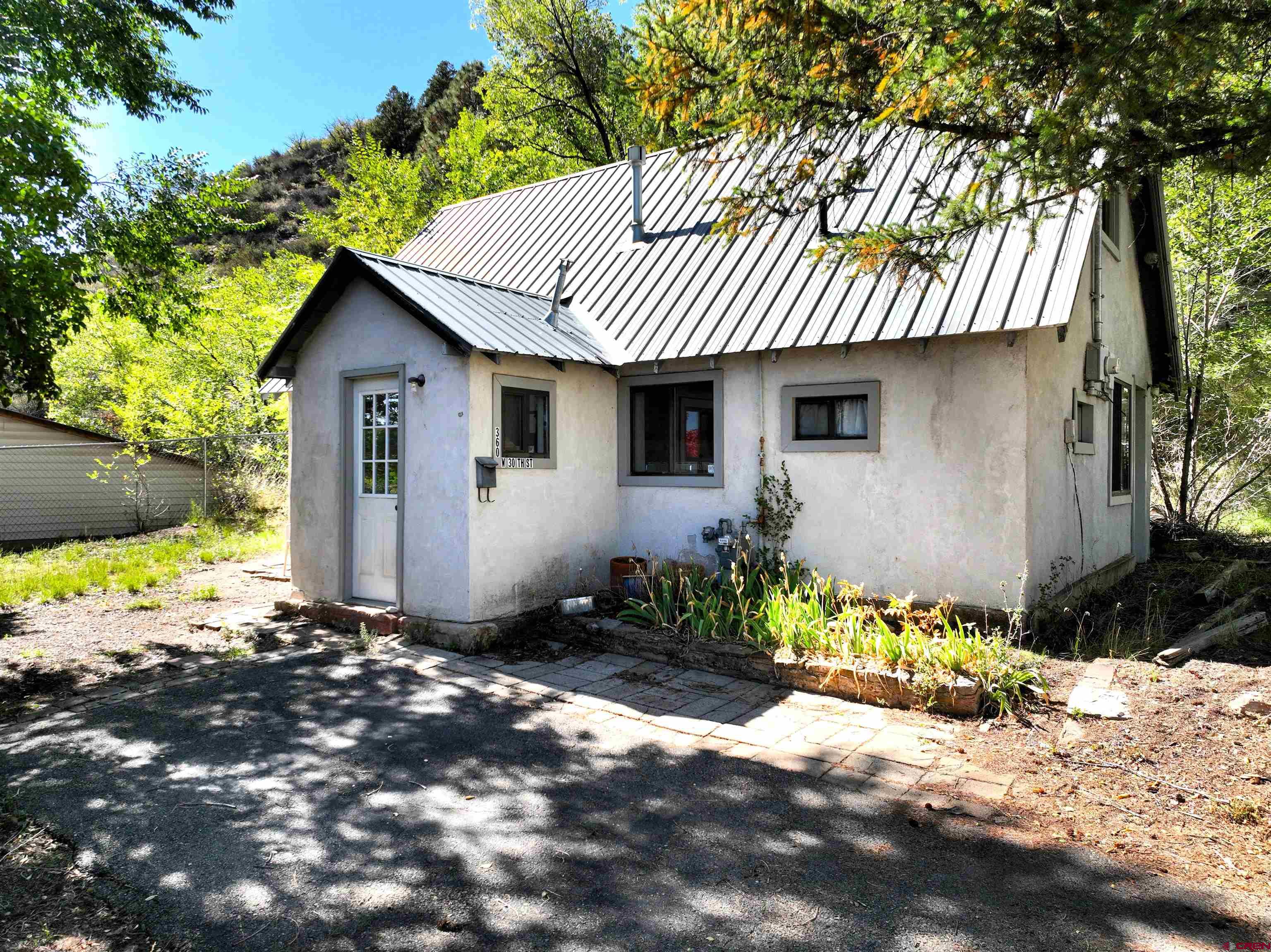 360 West 30th Street Durango, CO 81301 - Photo 5 of 30 a front view of a house with a yard