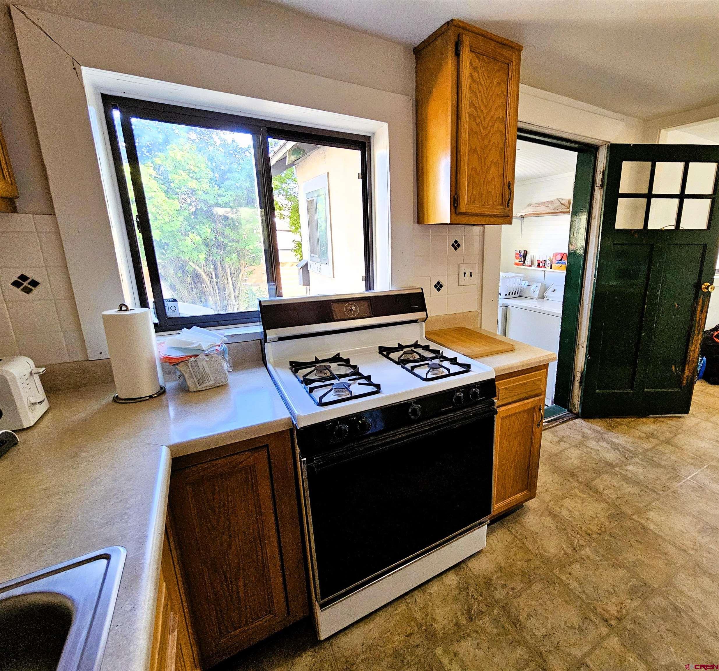 360 West 30th Street Durango, CO 81301 - Photo 9 of 30 a kitchen with a stove and a window