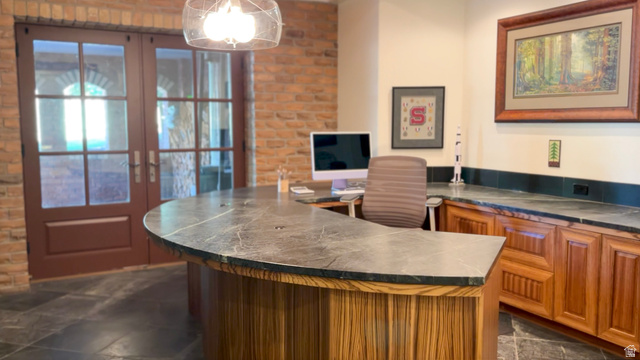 426 West Center Street Parowan, UT 84761 - Photo 58 of 107 Custom built-in desk with a stone countertop and wood-finish cabinetry