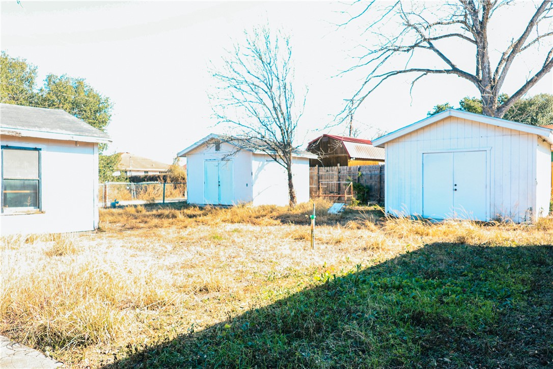 1023 Ross Avenue Alice, TX 78332 - Photo 11 of 13 Backyard with of 2 Storage Buildings