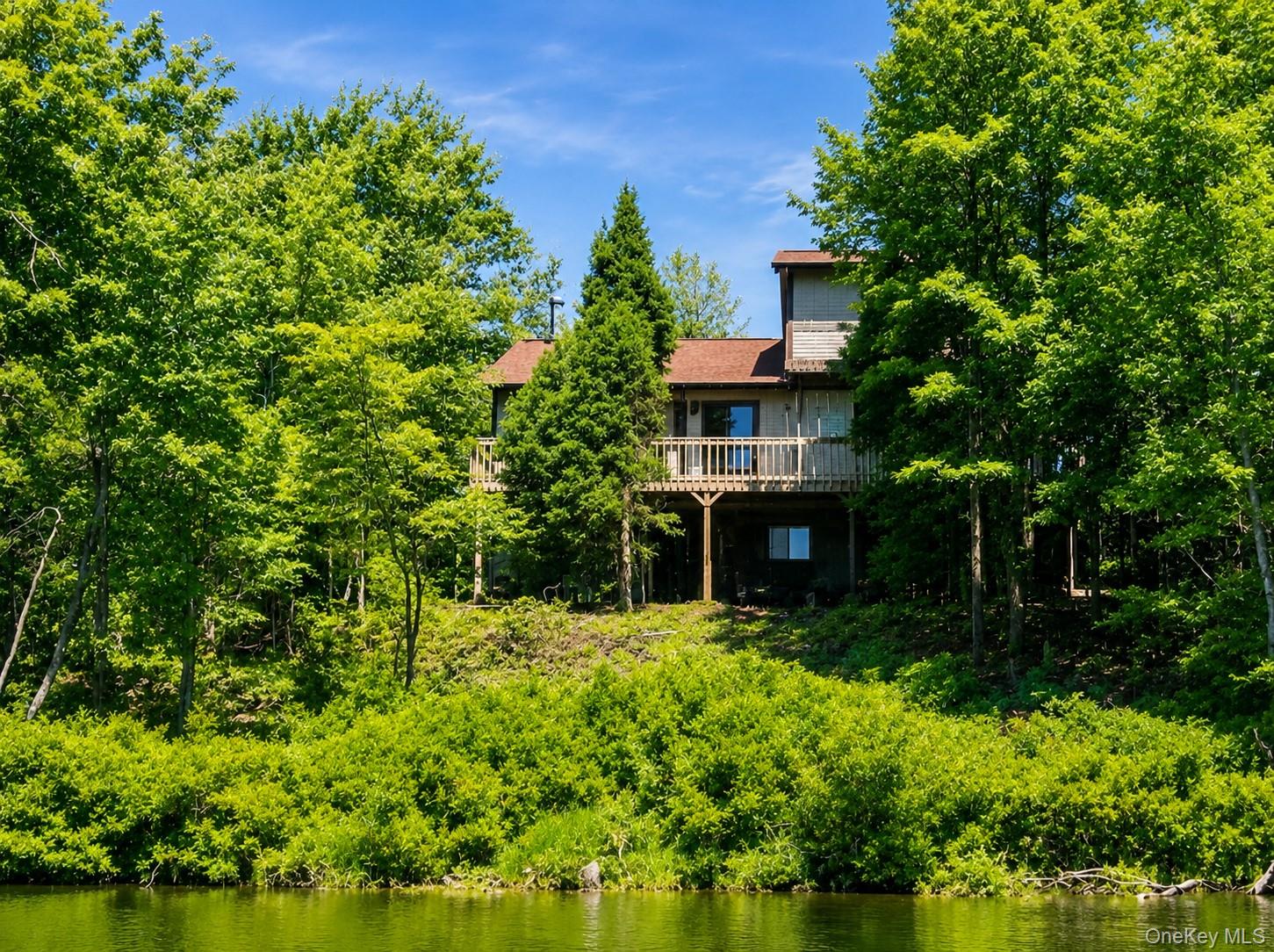 127 Beaver Dam Road, Unit LONG POND PA Long Pond, PA 18334 - Photo 1 of 16 Front of the house Looking at the Lake.