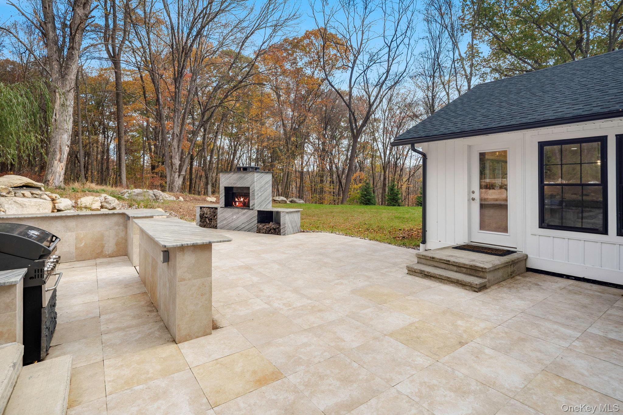 379 South White Rock Road Holmes, NY 12531 - Photo 17 of 26 Another view of patio featuring grilling area, fireplace and enormous granite countertops