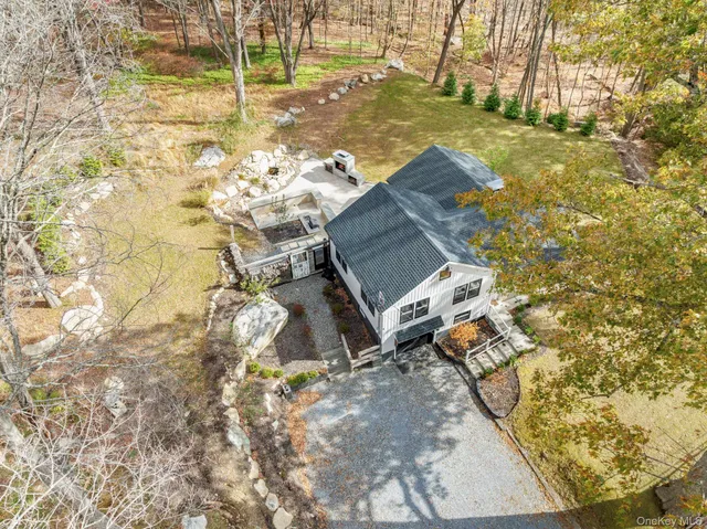 a aerial view of a house with yard