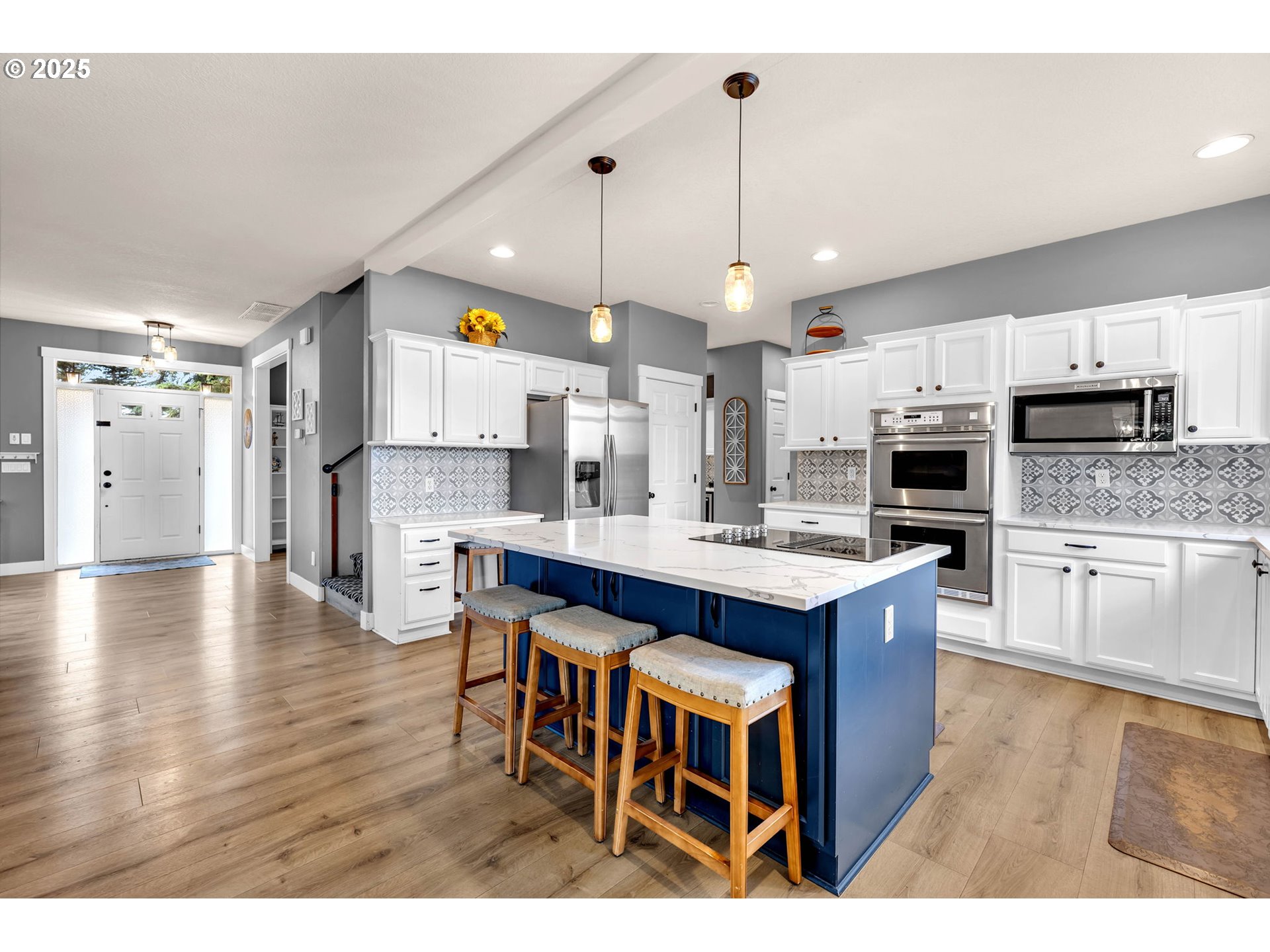 8805 Northeast 179th Street Battle Ground, WA 98604 - Photo 11 of 48 a kitchen with stainless steel appliances kitchen island a large island in the center