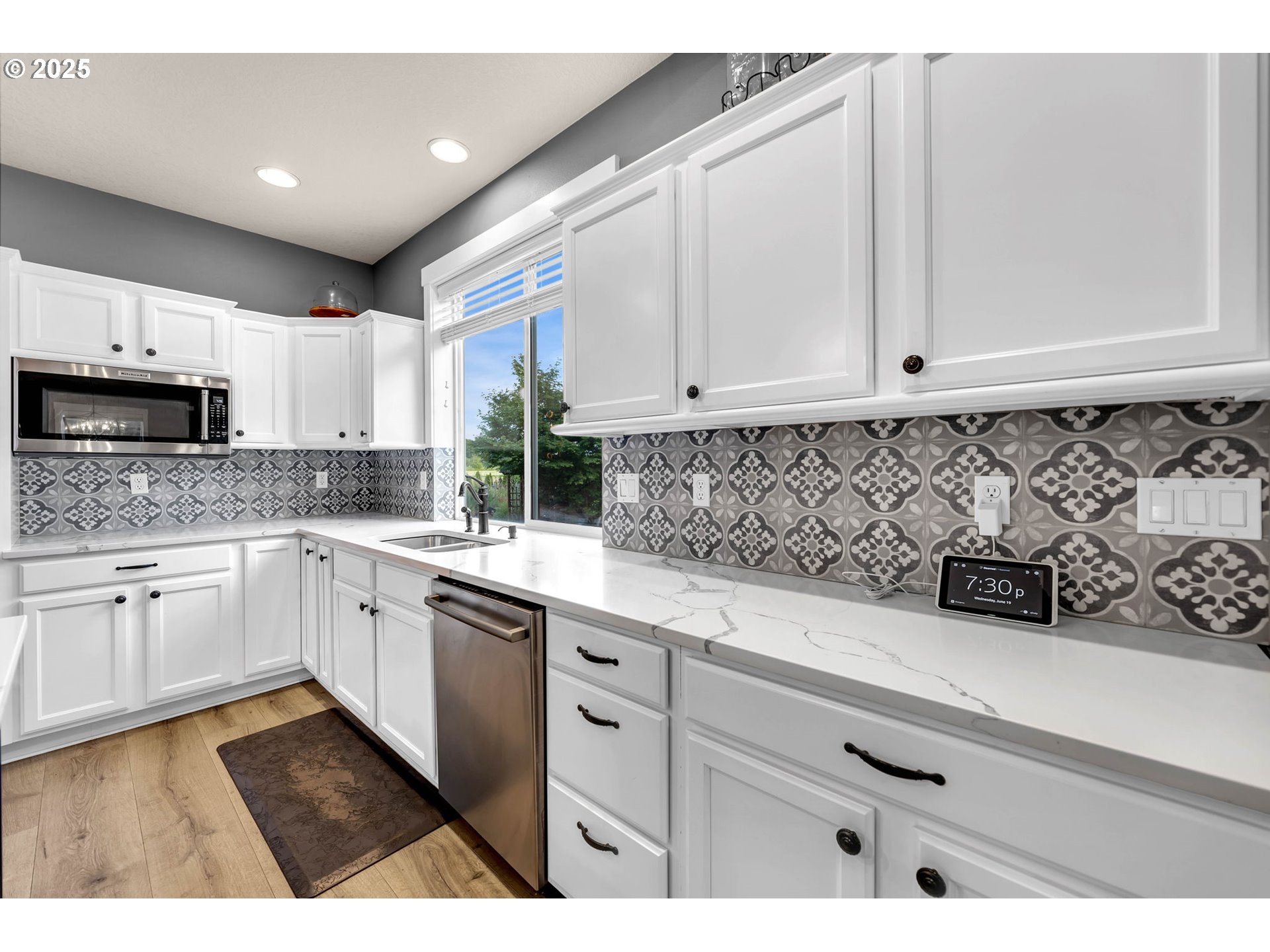 8805 Northeast 179th Street Battle Ground, WA 98604 - Photo 13 of 48 a kitchen with granite countertop white cabinets and white appliances