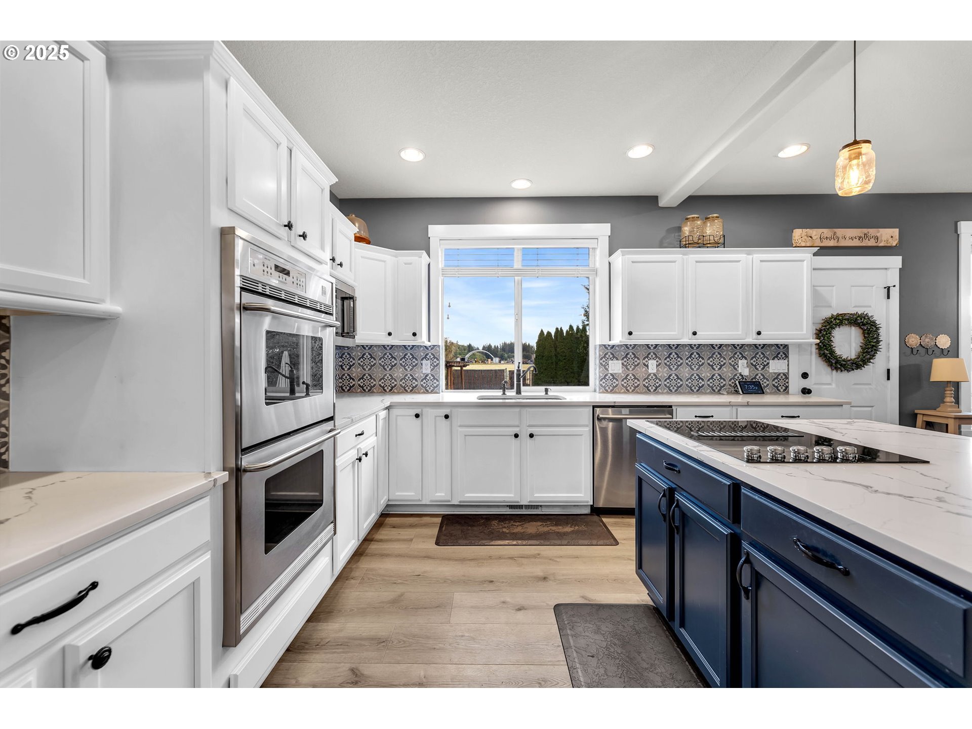 8805 Northeast 179th Street Battle Ground, WA 98604 - Photo 17 of 48 a kitchen with stainless steel appliances granite countertop a stove a sink and a refrigerator