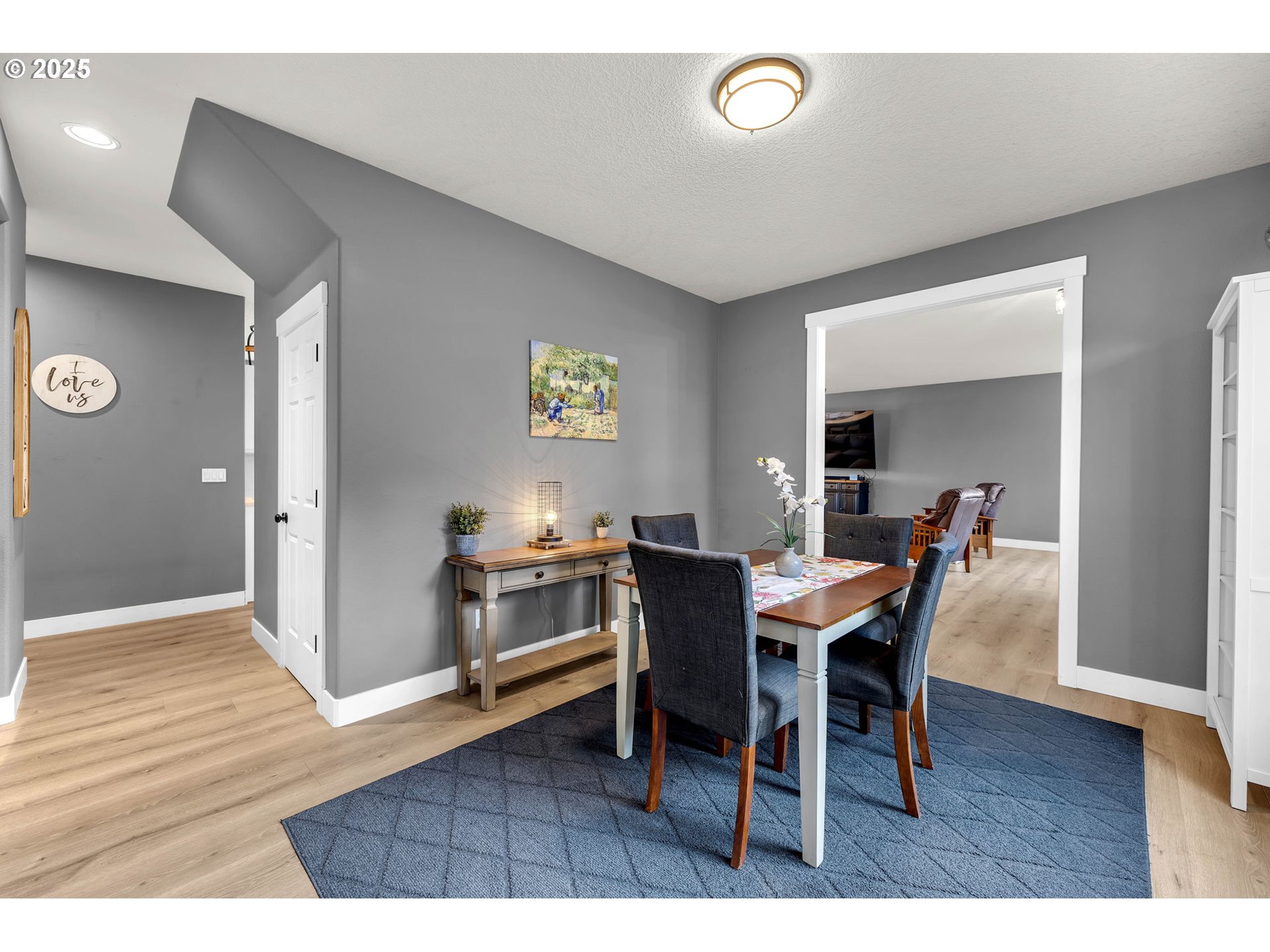 8805 Northeast 179th Street Battle Ground, WA 98604 - Photo 18 of 48 a view of a dining room with furniture and wooden floor