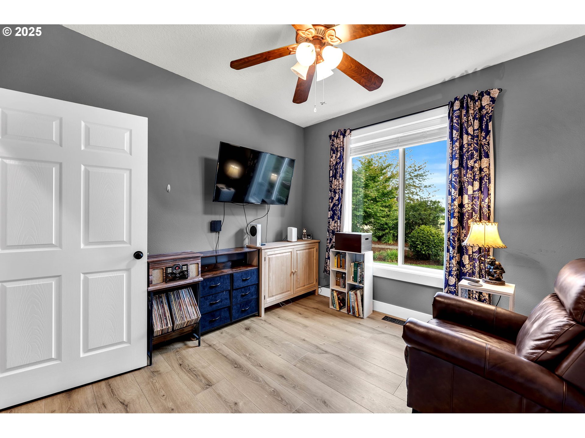 8805 Northeast 179th Street Battle Ground, WA 98604 - Photo 20 of 48 a living room with furniture and a flat screen tv