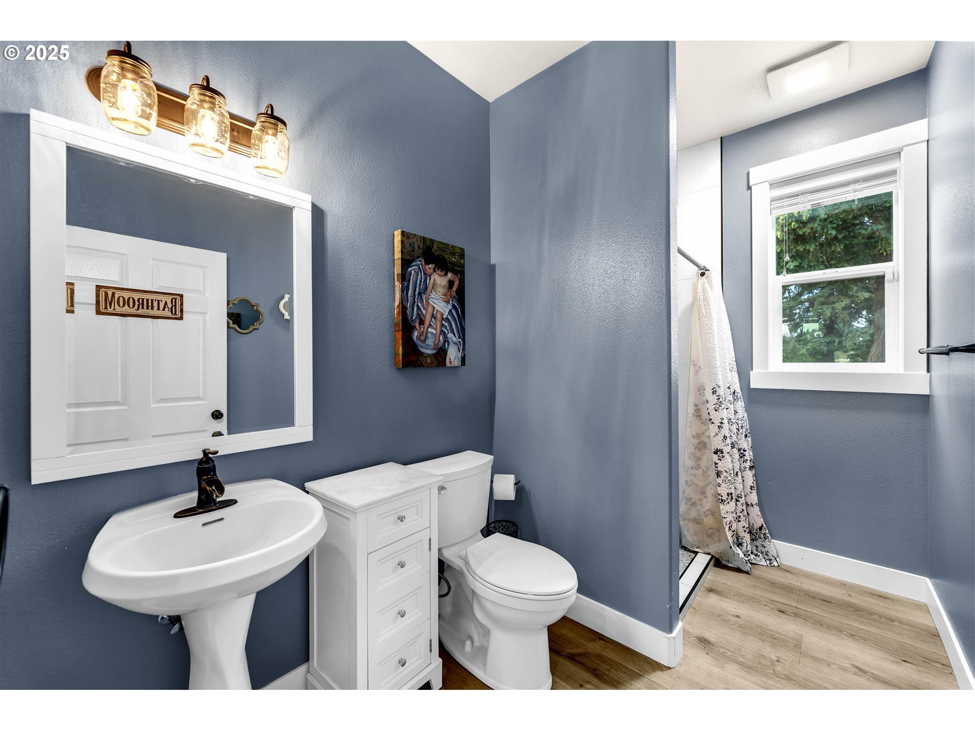 8805 Northeast 179th Street Battle Ground, WA 98604 - Photo 21 of 48 a bathroom with a sink a toilet and mirror