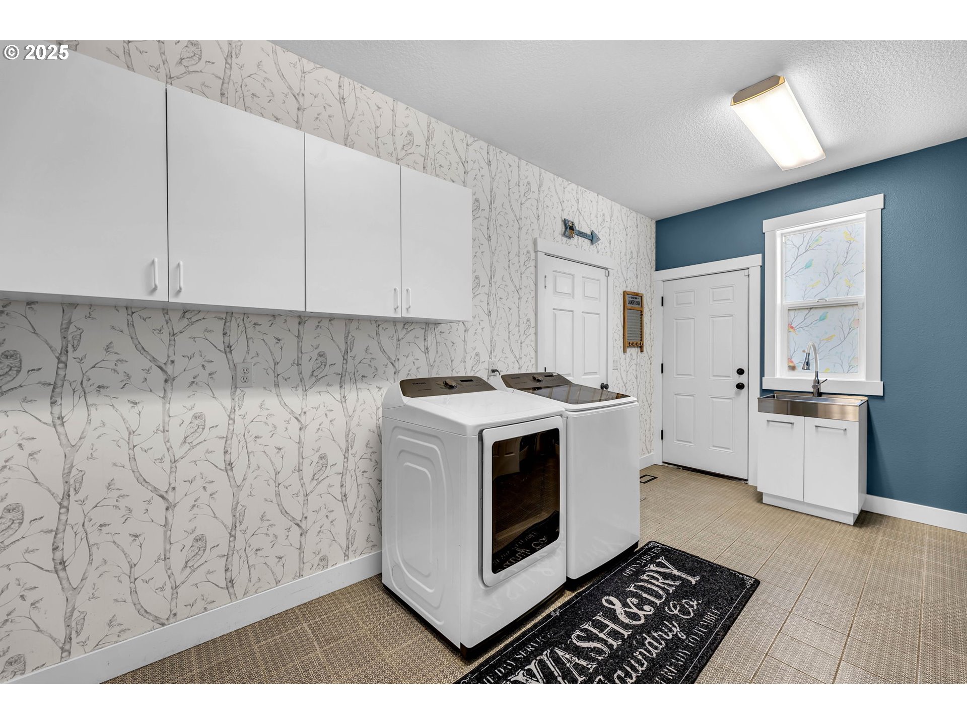 8805 Northeast 179th Street Battle Ground, WA 98604 - Photo 22 of 48 a view of kitchen with stove and white cabinets